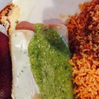 Tri Color Enchiladas · One chicken enchilada with salsa verde, one bean enchilada with nacho cheese dip, and one be...
