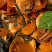 Zuppa Di Pesce · Lobster Tail, shrimp, calamari, mussels, clams, scallops, diced pieces of snapper, over squi...