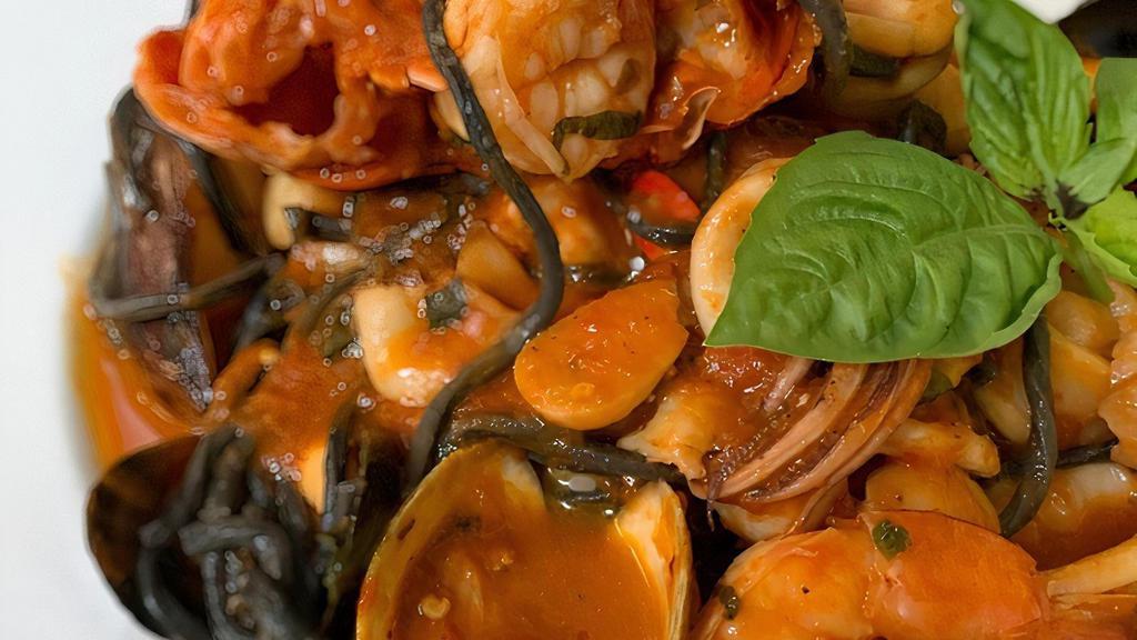 Zuppa Di Pesce · Lobster Tail, shrimp, calamari, mussels, clams, scallops, diced pieces of snapper, over squid ink spaghetti,with fradiavolo tomato sauce