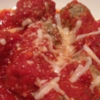 Meatballs · Topped with ricotta cheese and tomato sauce