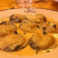 Seafood Ravioli · Stuffed with crabmeat and ricotta, served with lobster cream sauce