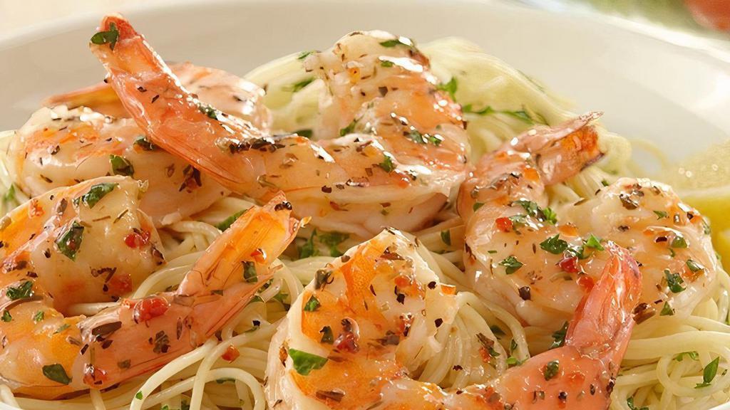 Shrimp Scampi · Jumbo shrimp over white wine butter sauce  over spaghetti