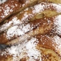 Side Of French Toast  · Two pieces of cinnamon-vanilla french toast sprinkled with powdered sugar
