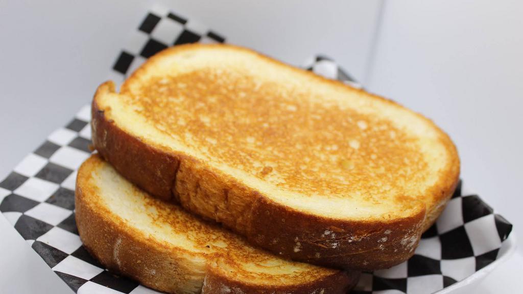 Thick Sliced White Buttered Toast · 2 slices of thick white buttered toast