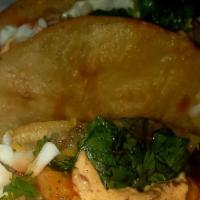 2 Shrimp Tacos 🌮  · Grilled shrimp served inside of a corn tortilla shell dressed with dry slaw, Chipotle sauce,...