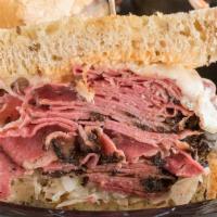 Reuben Sandwich · Grilled lean corned beef with sauerkraut, melted swiss cheese, and thousand island dressing ...