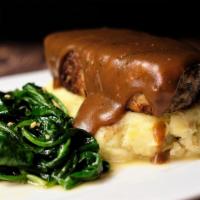 Keegans Meatloaf · Homemade with beef, pork and veal over mashed potatoes, covered with rich brown gravy, and w...