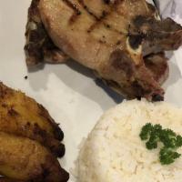 Grilled Pork Chop · Served with rice, beans, fried sweet plantain and salad.