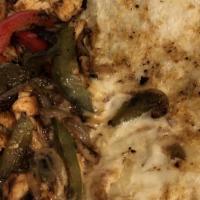 Super Fajita Quesadilla · A super cheese quesadilla stuffed with grilled chicken or steak, onions and peppers. Served ...