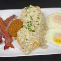 Biscuits & Gravy · Two buttermilk biscuits covered in Swaggerty's Country Sausage gravy, served with two eggs a...