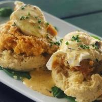 Chicken St. Charles · Fried chicken over a housemade buttermilk biscuit with two poached eggs, finished with a por...