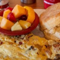 Three Little Pigs Omelet · Applewood-smoked bacon, ham & sausage with swiss cheese. Served with a buttermilk biscuit an...