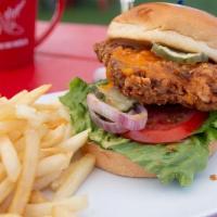 Fried Chicken Sandwich · Fried chicken topped with cheddar cheese, dressed with lettuce, tomato, red onion, pickles a...