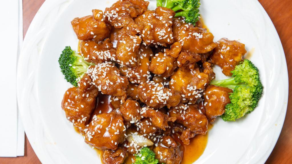 Sesame Chicken · Served with fried rice egg roll and crab rangoon.