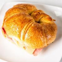 Croissant Sandwich Preparado  · Croissant sandwich with ham, cheese, croquettes, and potato sticks.