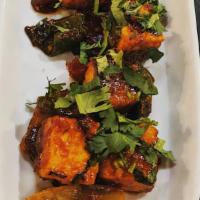 Chili Paneer · Vegetarian. Stir-fried paneer, onions, peppers, jalapeños, tossed in a tangy-hot sauce.