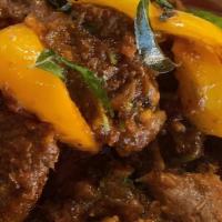 Karahi · Punjabi-style curry finished with onions & peppers.