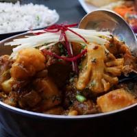 Aloo Gobi · Vegan. Potatoes, cauliflower, turmeric, house garam masala, tomatoes, garnished with cilantr...