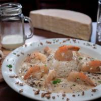 Camaro Ao Coco · Jumbo shrimp sautéed with coconut milk, mushroom, served with rice and fresh herbs.