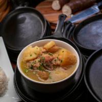 Sancocho De Gallina · Every other Sunday. Hen soup with potato, cassava and plantain served with banana, whole cob...