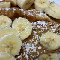 Croissant French Toast · Served open with powdered sugar.
( Bananas Extra)