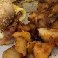 Bagel Sandwich · One egg with meat and cheese on a toasted bagel, served with choice of side.