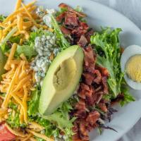 Cobb Salad · Mixed greens, ham, bacon, cheddar cheese, boiled egg, fresh avocado, and tomatoes.