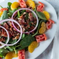 Fresh Spinach Salad · Spinach, applewood smoked bacon, pecans, red onions, tomatoes, and mandarin oranges, with ho...
