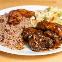 Oxtail Dinner · Served with rice and peas or white rice, plantains, steamed vegetables.