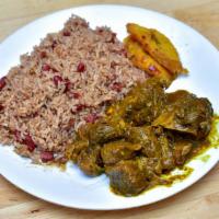 Curry Goat Dinner · Served with rice and peas or white rice, plantains, steamed vegetables.