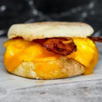 English Muffin, Bacon, Egg, & Cheddar · 2 scrambled eggs, melted Cheddar cheese, smoked bacon, and Sriracha aioli on a toasted Engli...