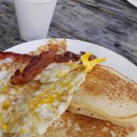 Trey'S Favorite · 2 pancakes, 2 pieces of bacon and 2 eggs.