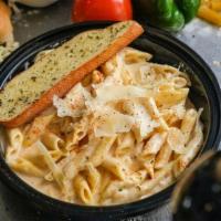 Penne Alla Vodka · Penne pasta tossed in our house-made creamy pink vodka sauce. Served with garlic bread.