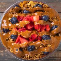 Very Berry · acai, banana, and mixed berries. Topped with granola, almond butter, blueberries & strawberr...