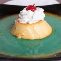Flan · Creamy Mexican custard topped with whipped cream and a cherry.