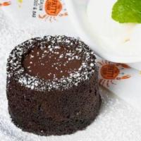 Chocolate Molten Lava Cake · Molten cake, ice cream, oreo crumb, and chocolate syrup.