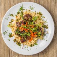 Kabobs · Ribeye steak served with seasoned white rice, arugula salad chimichurri sauce.