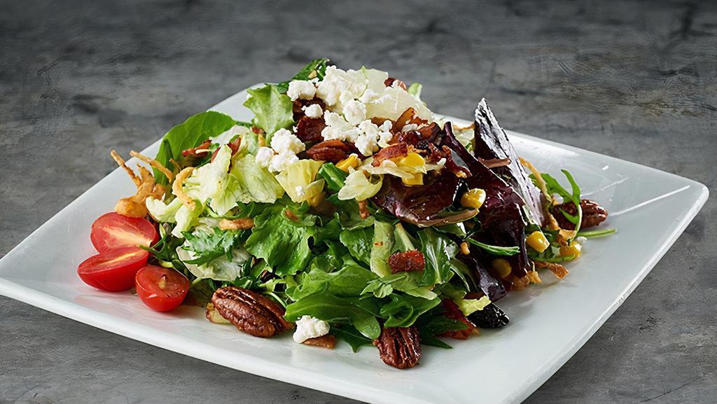 Harvest Salad · Mixed greens, roasted corn, dried cherries, bacon, tomatoes, white balsamic vinaigrette, goat cheese and cajun pecans