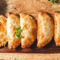 Handmade Empanadas · Two, with the choice of: beef, chicken,. ham & cheese, spinach