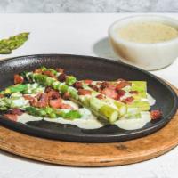 Asparagus · Oven-roasted, topped with crispy bacon flakes and Blue Cheese, Parmesan, and white wine sauce