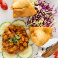 Samosa Choley · Crispy, deep-fried vegetable patties stuffed with potato sand green peas. Flavored with fres...