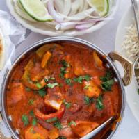 Chicken Tikka Masala · Tender, boneless pieces of chicken, bell pepper, onion cooked in a hot and spicy tomato-base...
