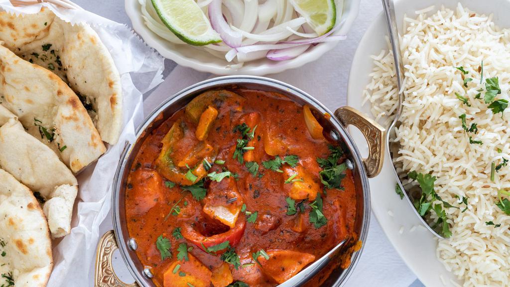 Chicken Tikka Masala · Tender, boneless pieces of chicken, bell pepper, onion cooked in a hot and spicy tomato-based sauce flavored with fresh Indian herb.