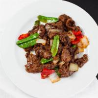 Black Pepper Beef · Sliced beef seasoned with black pepper and a homemade Worcestershire sauce, served with onio...