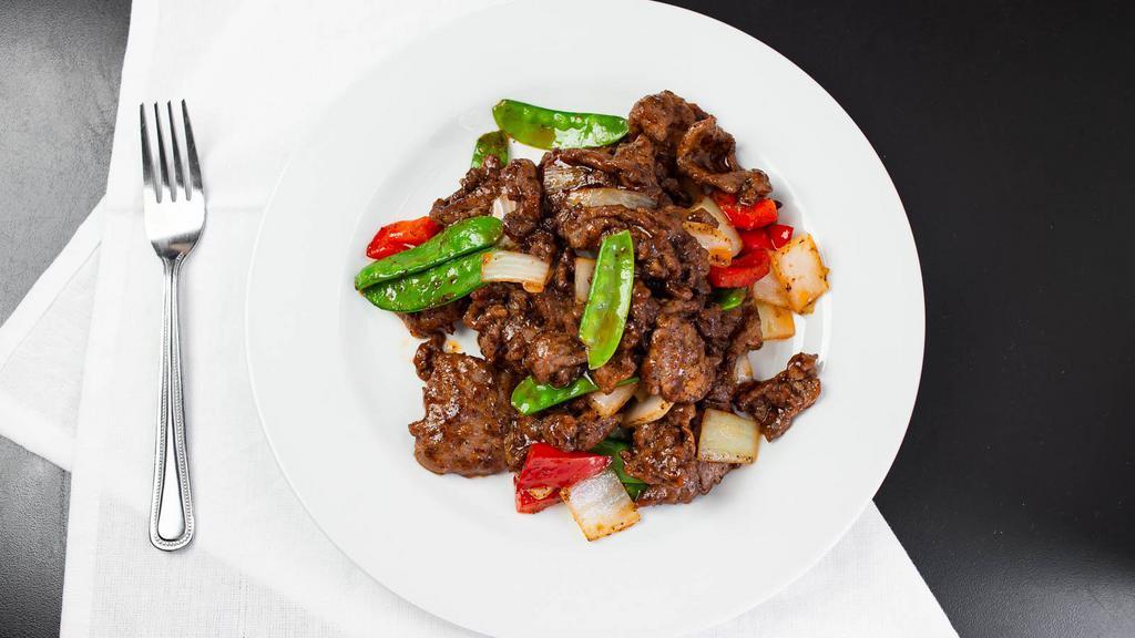 Black Pepper Beef · Sliced beef seasoned with black pepper and a homemade Worcestershire sauce, served with onion and red bell peppers.