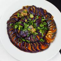 Dragon Eggplant In Spicy Garlic Sauce · A reimagining of a classic dish. Thinly sliced eggplant sautéed in a lightly spiced garlic s...