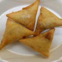 Beef Samosa (4 Pcs) · A fried triangular savory pastry containing beef, herb, and spices. Served with green chutney.