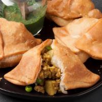 Vegetable (Punjabi) Samosa · 3 jumbo pieces of crispy samosa filled with a spicy potato and green pea filling.