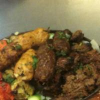 Mix Grill Platter · Includes chicken tikka boti (boneless), chicken Sheek kabab, Malai kabab, beef Sheek kabab, ...