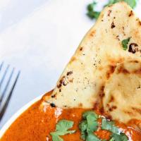 Butter Chicken · Boneless chicken breast cooked in creamy and buttery mild curry sauce. Served with your choi...